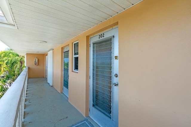 2121 NE 1st Ct Unit 202, Boynton Beach, FL 33435 - doorway to property with a balcony