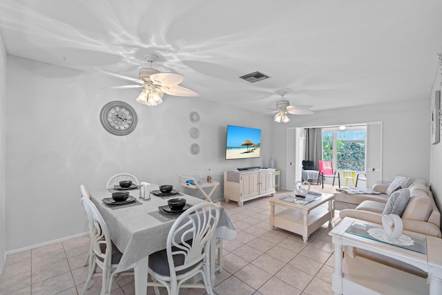 2121 NE 1st Ct Unit 202, Boynton Beach, FL 33435 - dining space featuring ceiling fan and light tile patterned floors