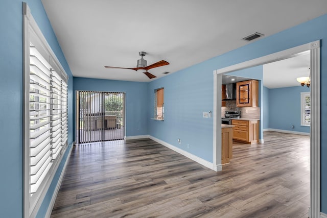 165 Cordoba Cir, Royal Palm Beach, FL 33411 - spare room featuring wood finished floors, ceiling fan, and baseboards