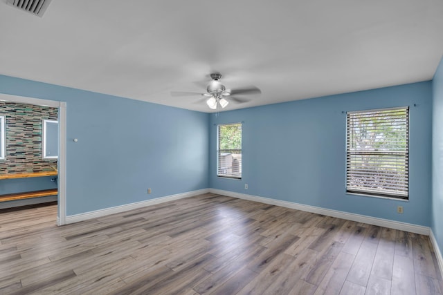 165 Cordoba Cir, Royal Palm Beach, FL 33411 - spare room with ceiling fan, wood finished floors, and baseboards