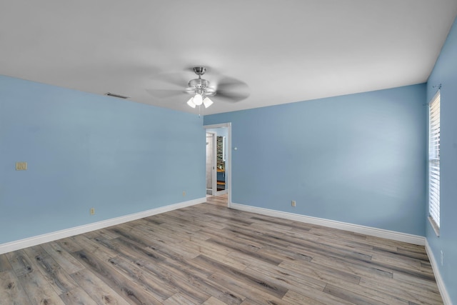 165 Cordoba Cir, Royal Palm Beach, FL 33411 - empty room with wood finished floors, baseboards, and ceiling fan
