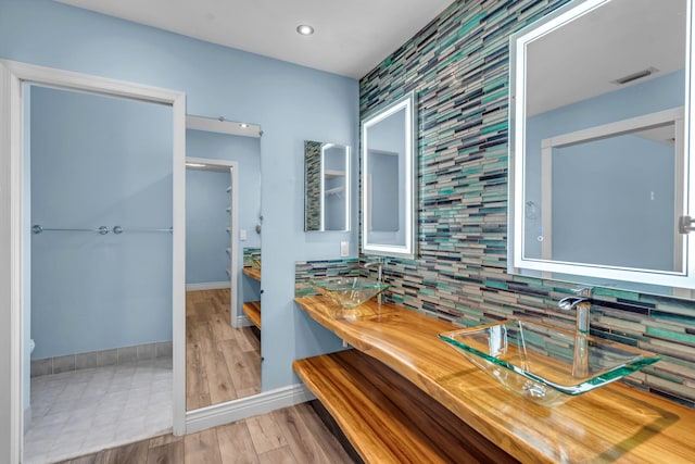 165 Cordoba Cir, Royal Palm Beach, FL 33411 - full bath featuring double vanity, tasteful backsplash, baseboards, wood finished floors, and recessed lighting