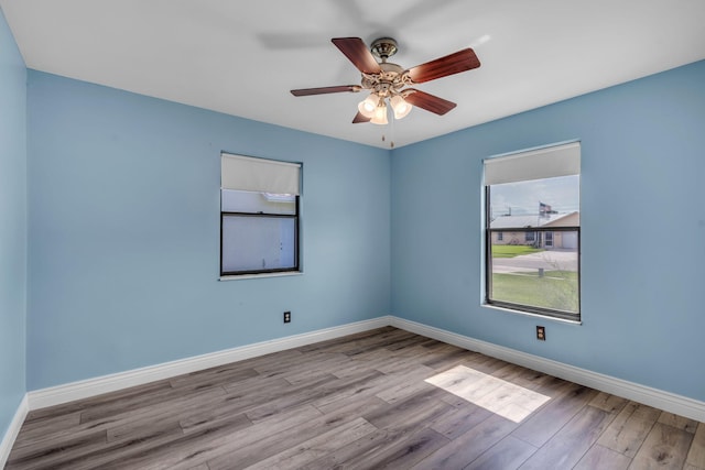165 Cordoba Cir, Royal Palm Beach, FL 33411 - empty room featuring wood finished floors, baseboards, and ceiling fan