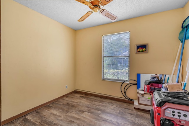 165 Cordoba Cir, Royal Palm Beach, FL 33411 - interior space with ceiling fan, wood finished floors, baseboards, and a textured ceiling
