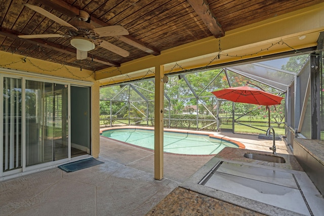 165 Cordoba Cir, Royal Palm Beach, FL 33411 - outdoor pool featuring a sink, a patio area, ceiling fan, and a lanai