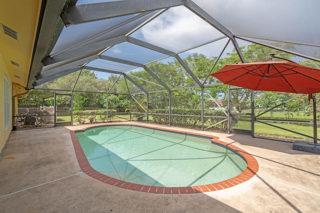 165 Cordoba Cir, Royal Palm Beach, FL 33411 - outdoor pool featuring glass enclosure and a patio area