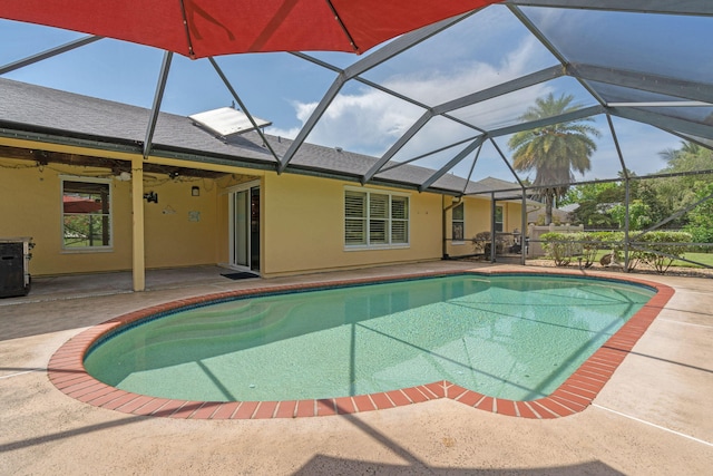 165 Cordoba Cir, Royal Palm Beach, FL 33411 - outdoor pool with a patio area, ceiling fan, and glass enclosure