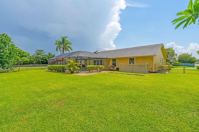 165 Cordoba Cir, Royal Palm Beach, FL 33411 - back of house with stucco siding and a lanai