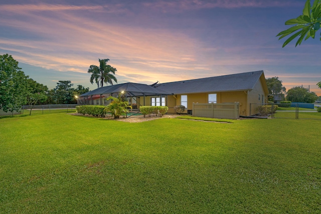 165 Cordoba Cir, Royal Palm Beach, FL 33411 - back of property at dusk with a lanai and a swimming pool