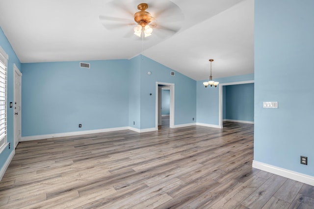 165 Cordoba Cir, Royal Palm Beach, FL 33411 - unfurnished room featuring ceiling fan, a chandelier, lofted ceiling, wood finished floors, and baseboards