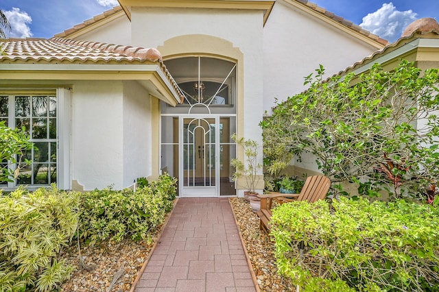 6078 Slice Ct, Boynton Beach, FL 33437 - property entrance featuring stucco siding and a tiled roof