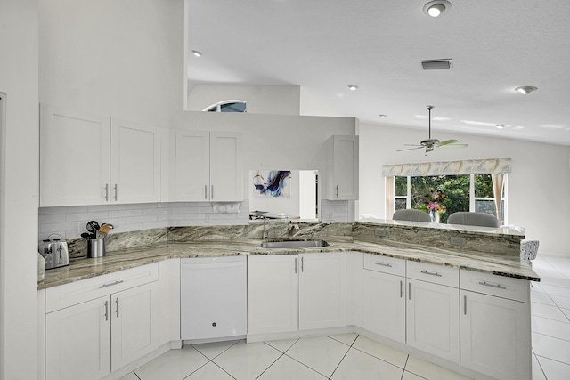 6078 Slice Ct, Boynton Beach, FL 33437 - kitchen featuring a sink, ceiling fan, lofted ceiling, white dishwasher, and light stone counters