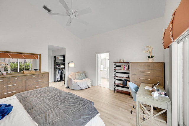 6078 Slice Ct, Boynton Beach, FL 33437 - bedroom with high vaulted ceiling, a walk in closet, light wood-style floors, an office area, and connected bathroom