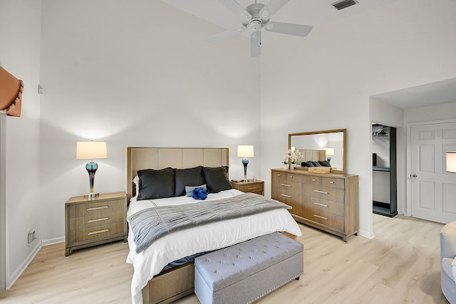 6078 Slice Ct, Boynton Beach, FL 33437 - bedroom with light wood-style flooring, baseboards, a high ceiling, and ceiling fan