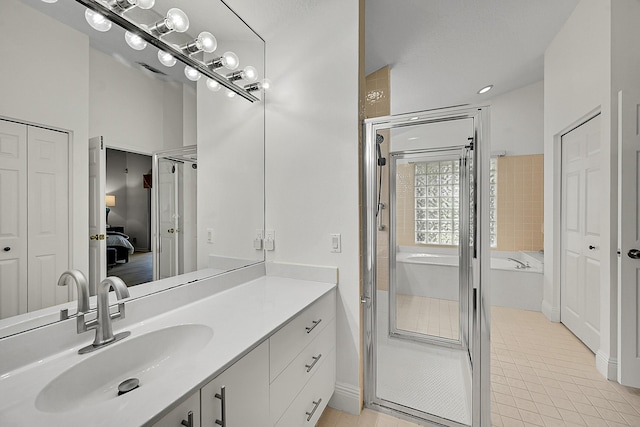 6078 Slice Ct, Boynton Beach, FL 33437 - ensuite bathroom with a garden tub, vanity, a shower stall, and a closet