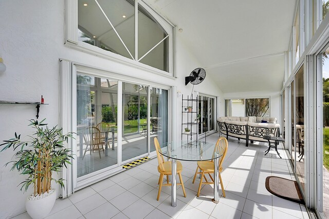 6078 Slice Ct, Boynton Beach, FL 33437 - sunroom / solarium featuring high vaulted ceiling, tile patterned flooring, and an outdoor living space