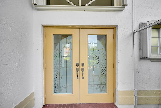 6078 Slice Ct, Boynton Beach, FL 33437 - view of exterior entry with french doors and stucco siding