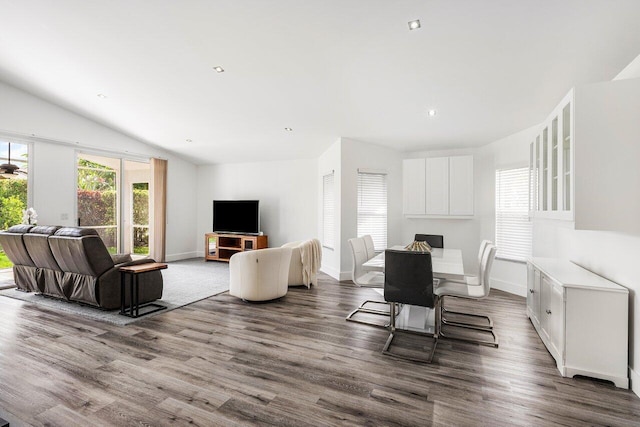 2802 Waters Edge Cir, Greenacres, FL 33413 - dining room with dark wood-style floors, baseboards, lofted ceiling, and recessed lighting
