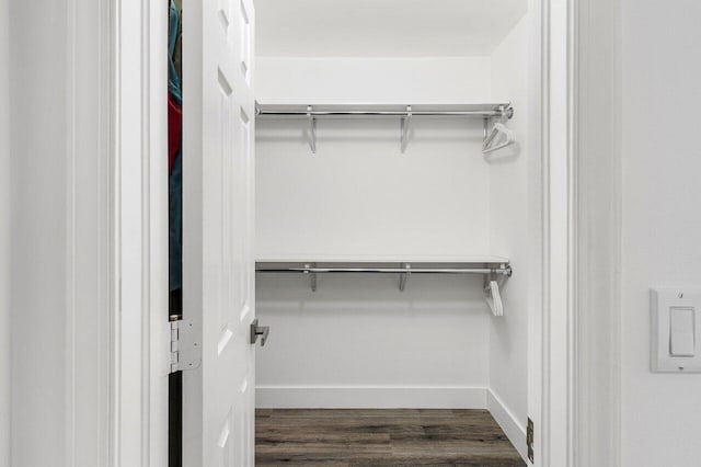2802 Waters Edge Cir, Greenacres, FL 33413 - spacious closet featuring dark wood-style flooring