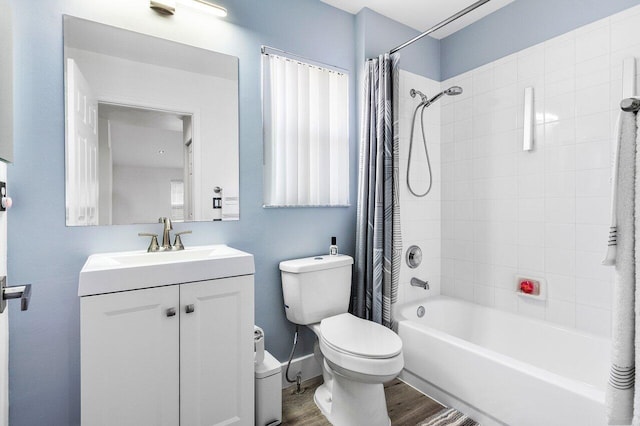 2802 Waters Edge Cir, Greenacres, FL 33413 - full bath featuring toilet, vanity, shower / tub combo, wood finished floors, and plenty of natural light