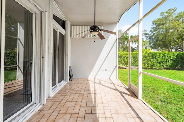 2802 Waters Edge Cir, Greenacres, FL 33413 - unfurnished sunroom with a ceiling fan