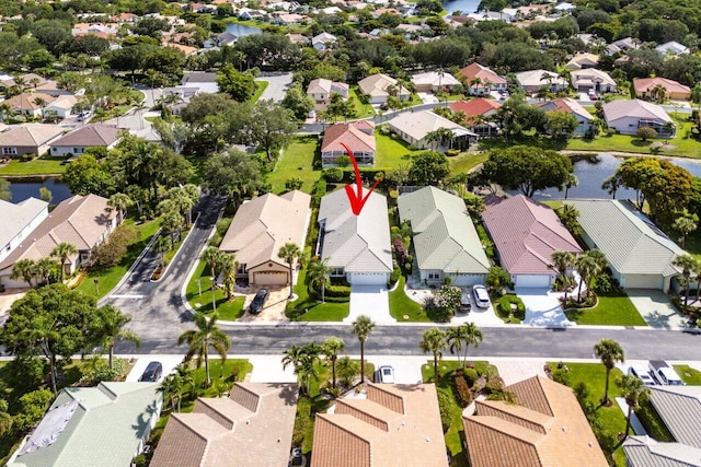 2802 Waters Edge Cir, Greenacres, FL 33413 - aerial perspective of suburban area with a nearby body of water