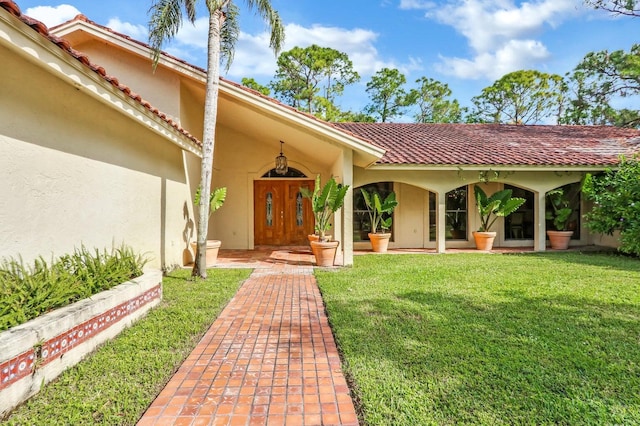 11357 Roselynn Way, Lake Worth, FL 33449 - entrance to property featuring stucco siding, a lawn, and a tile roof