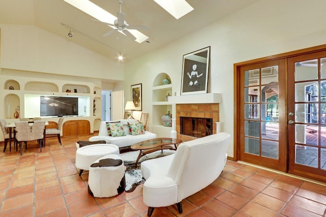 11357 Roselynn Way, Lake Worth, FL 33449 - living room featuring built in features, a skylight, ceiling fan, a tile fireplace, and track lighting