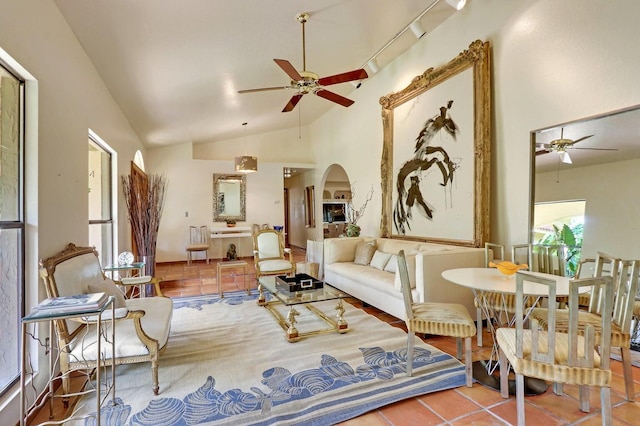 11357 Roselynn Way, Lake Worth, FL 33449 - tiled living room featuring ceiling fan, vaulted ceiling, and arched walkways