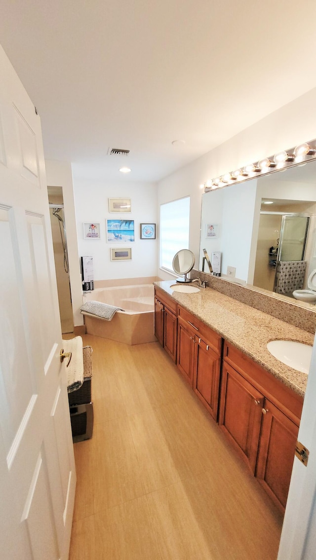 12484 Pleasant Green Way, Boynton Beach, FL 33437 - bathroom with a shower stall, a garden tub, double vanity, and wood finished floors