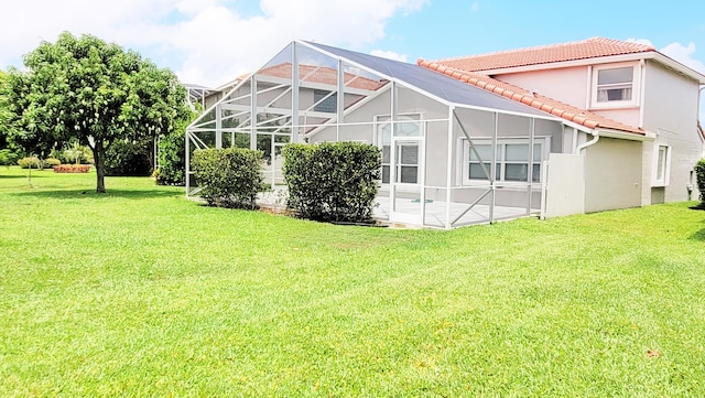 12484 Pleasant Green Way, Boynton Beach, FL 33437 - back of property featuring a tiled roof, stucco siding, a lawn, and a patio