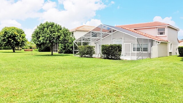 12484 Pleasant Green Way, Boynton Beach, FL 33437 - view of grassy yard with glass enclosure