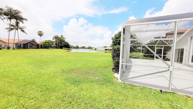 12484 Pleasant Green Way, Boynton Beach, FL 33437 - view of grassy yard featuring a water view, a lanai, and a patio area