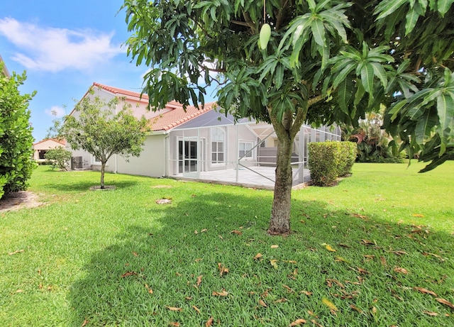 12484 Pleasant Green Way, Boynton Beach, FL 33437 - view of green lawn with a patio area and a lanai