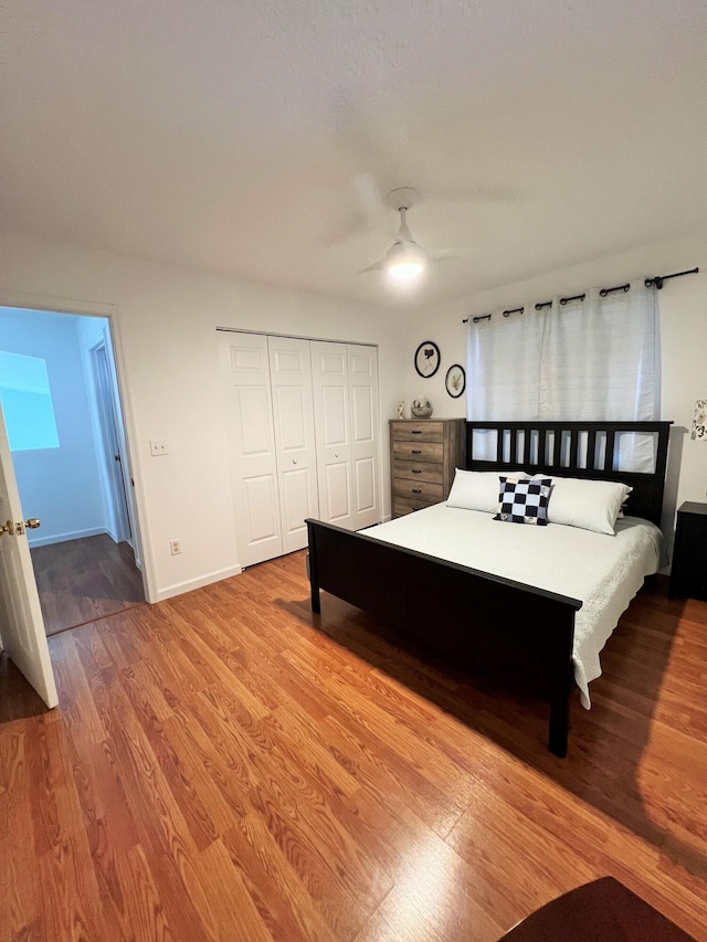 12484 Pleasant Green Way, Boynton Beach, FL 33437 - bedroom with wood finished floors, a closet, baseboards, and ceiling fan