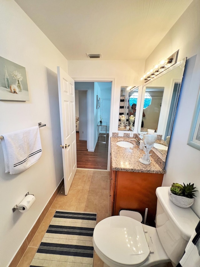 12484 Pleasant Green Way, Boynton Beach, FL 33437 - bathroom with vanity, toilet, tile patterned flooring, and baseboards
