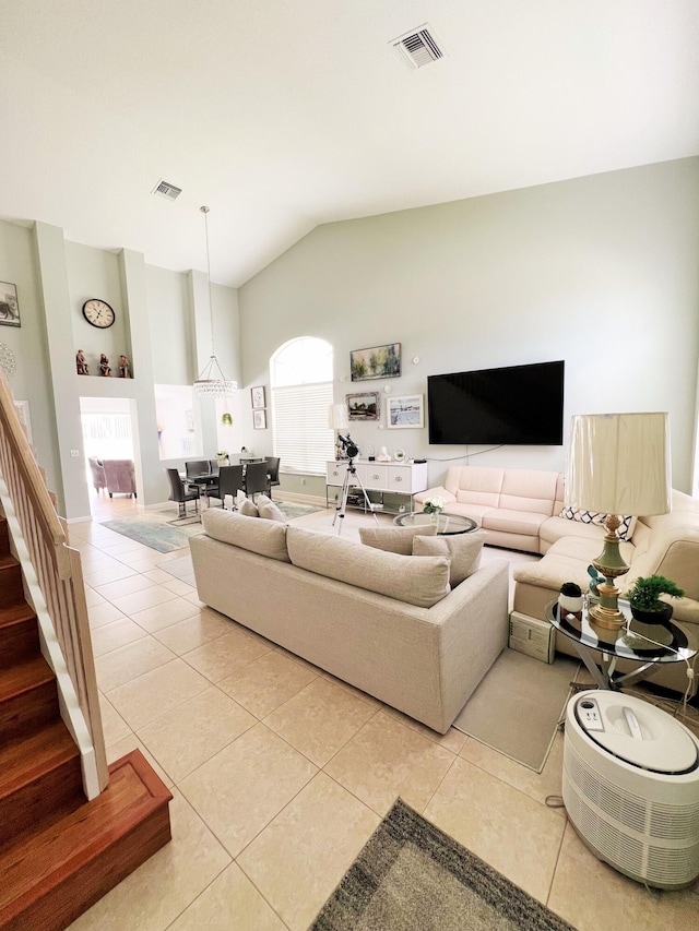 12484 Pleasant Green Way, Boynton Beach, FL 33437 - living room with light tile patterned floors, vaulted ceiling, and stairway