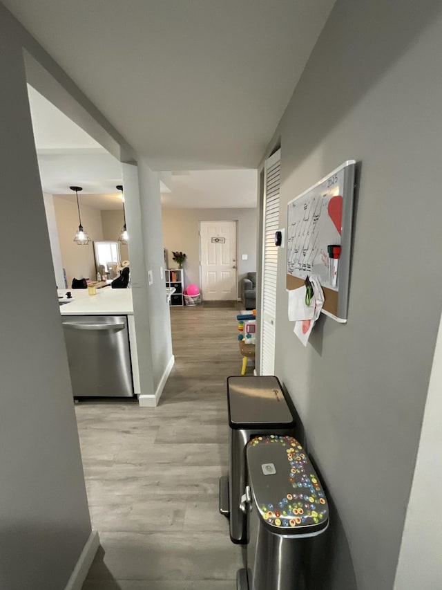 1530 SE Royal Green Cir Unit N103, Port Saint Lucie, FL 34952 - corridor featuring baseboards and light wood-type flooring
