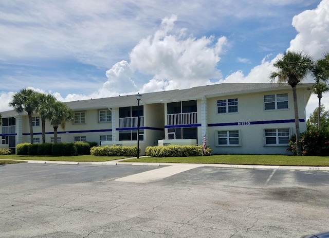 1530 SE Royal Green Cir Unit N103, Port Saint Lucie, FL 34952 - view of property with uncovered parking