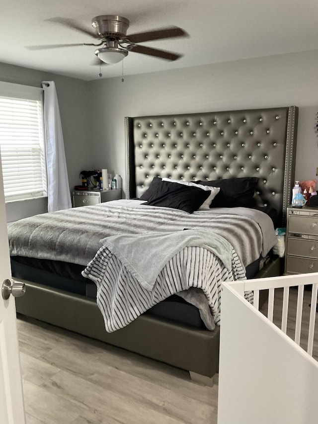 1530 SE Royal Green Cir Unit N103, Port Saint Lucie, FL 34952 - bedroom featuring wood finished floors and a ceiling fan