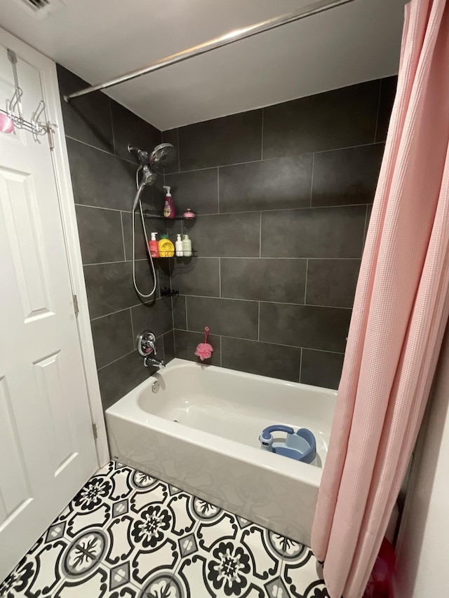 1530 SE Royal Green Cir Unit N103, Port Saint Lucie, FL 34952 - bathroom featuring tile patterned floors and shower / bath combo with shower curtain