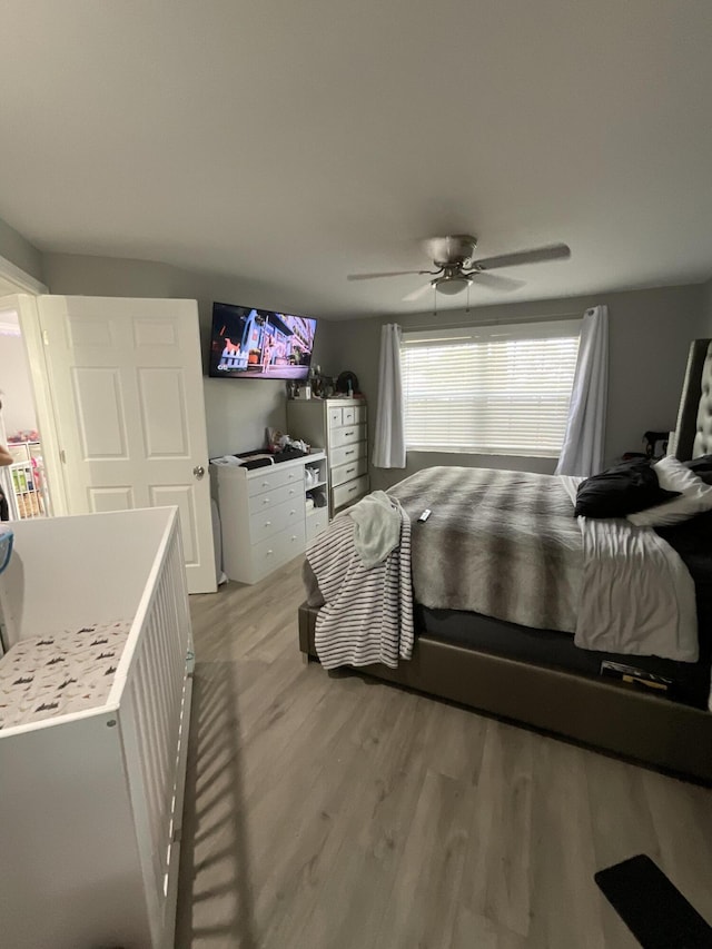 1530 SE Royal Green Cir Unit N103, Port Saint Lucie, FL 34952 - bedroom with light wood-type flooring and a ceiling fan