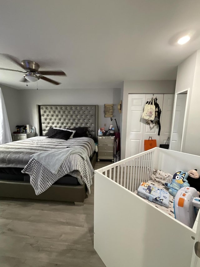 1530 SE Royal Green Cir Unit N103, Port Saint Lucie, FL 34952 - bedroom with wood finished floors, a closet, and a ceiling fan