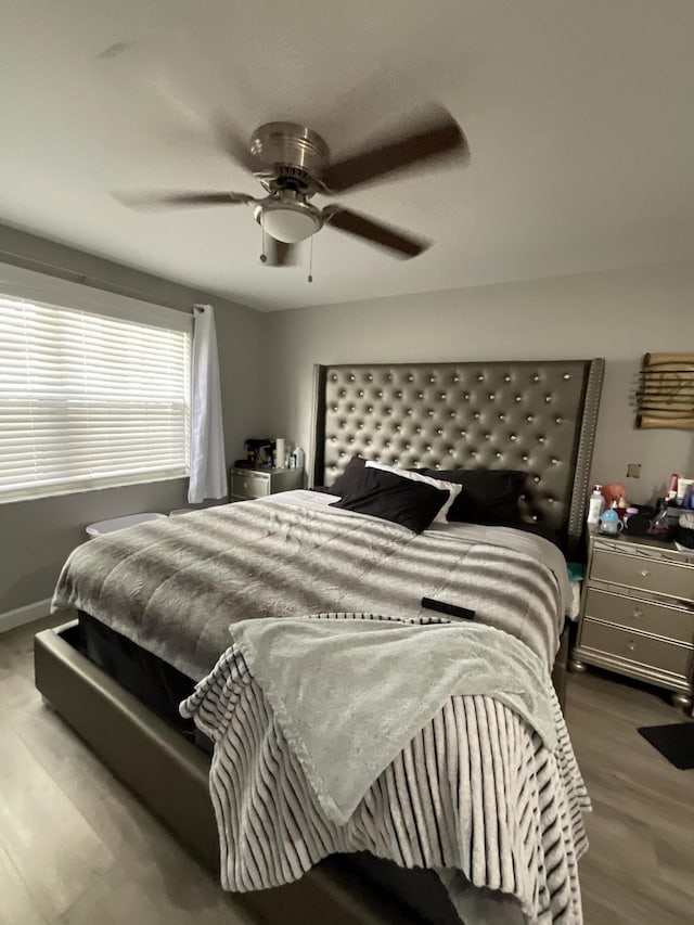1530 SE Royal Green Cir Unit N103, Port Saint Lucie, FL 34952 - bedroom featuring wood finished floors and a ceiling fan