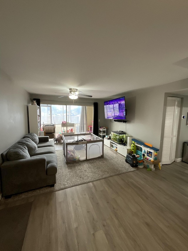 1530 SE Royal Green Cir Unit N103, Port Saint Lucie, FL 34952 - living area featuring wood finished floors and a ceiling fan