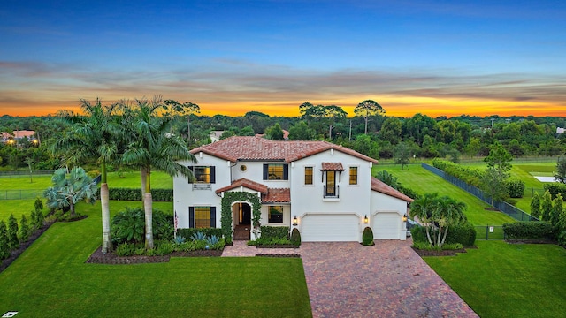 8164 SE Old Plantation Cir, Jupiter, FL 33458 - mediterranean / spanish-style home featuring a tiled roof, stucco siding, driveway, a garage, and a chimney