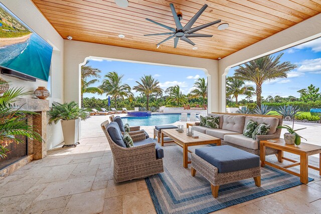 8164 SE Old Plantation Cir, Jupiter, FL 33458 - view of patio with ceiling fan, an outdoor hangout area, and a pool with connected hot tub