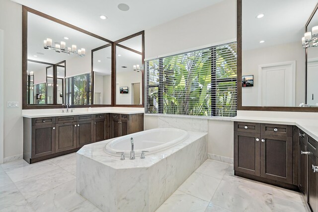 8164 SE Old Plantation Cir, Jupiter, FL 33458 - bathroom featuring a bath, marble finish floors, vanity, baseboards, and recessed lighting