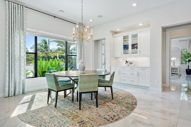 8164 SE Old Plantation Cir, Jupiter, FL 33458 - dining area with a chandelier, light marble finish flooring, recessed lighting, and baseboards