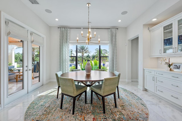 8164 SE Old Plantation Cir, Jupiter, FL 33458 - dining area featuring light marble finish flooring, a chandelier, recessed lighting, baseboards, and french doors